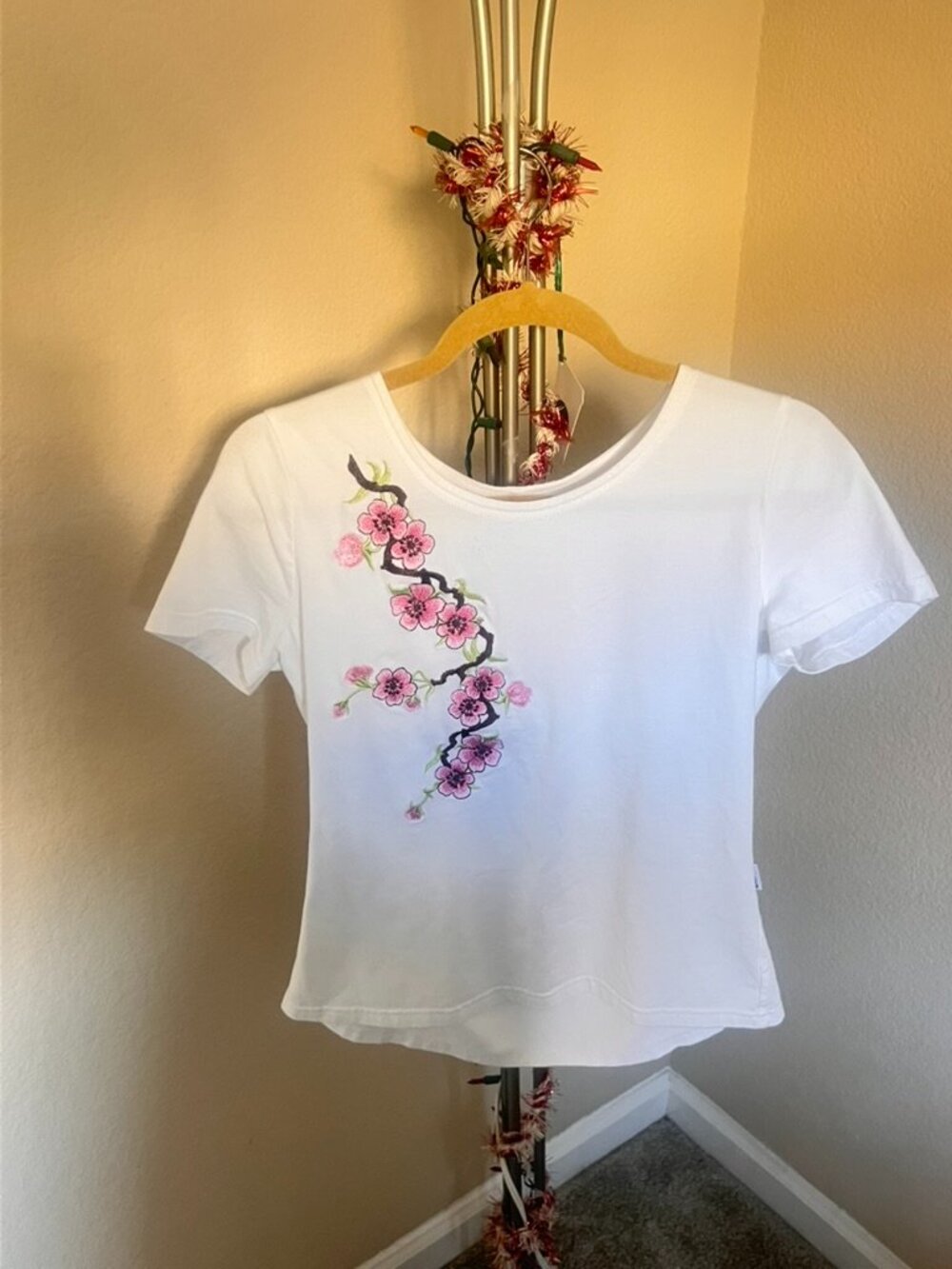 Embroidered T-shirt with branch of cherry blossoms